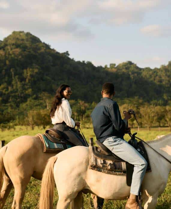 A couple horseback riding at The Stables at Sleeping Giant.